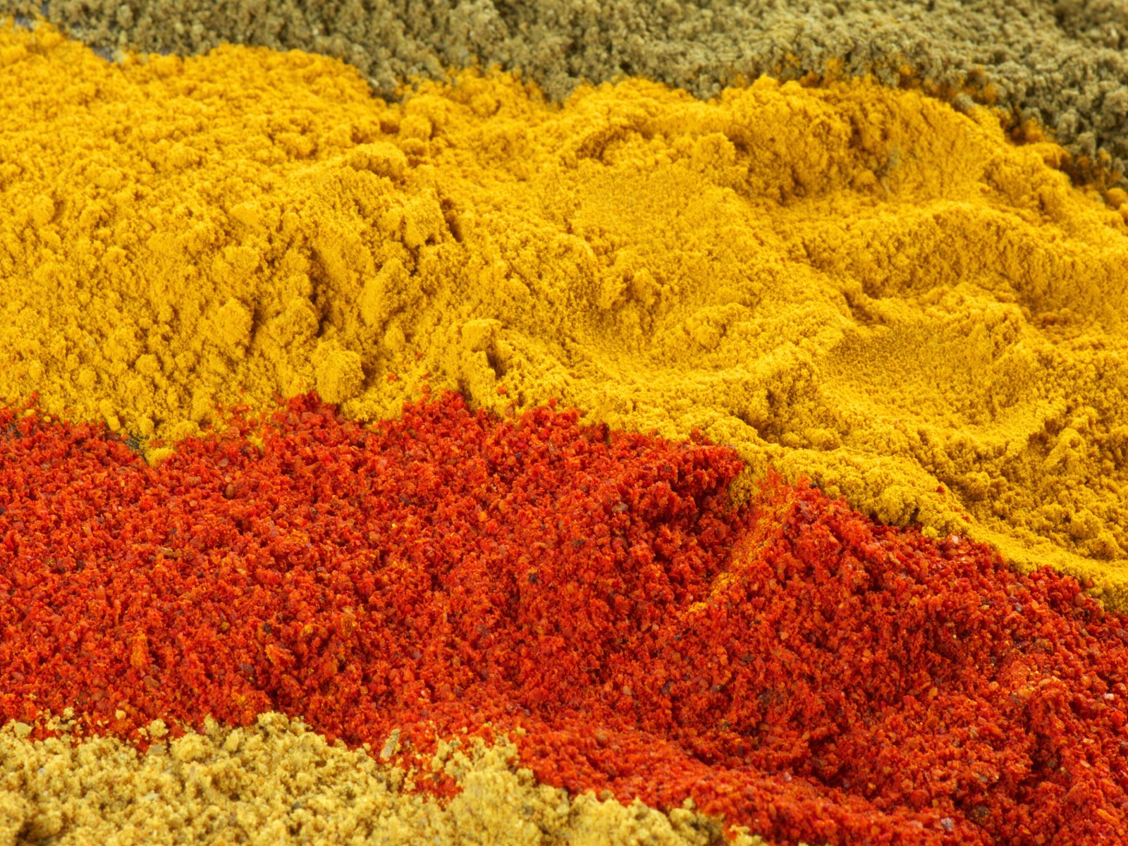 Close-up of assorted loose powder spices.Shallow DOF.